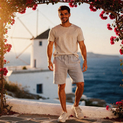 Lightweight casual shorts in light gray, made from breathable fabric, featuring pockets and an elastic waistband, view
