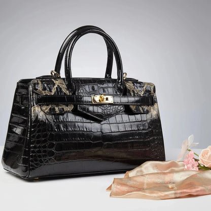View of a chic textured leather shoulder bag in deep burgundy, showcasing its large capacity and elegant design features