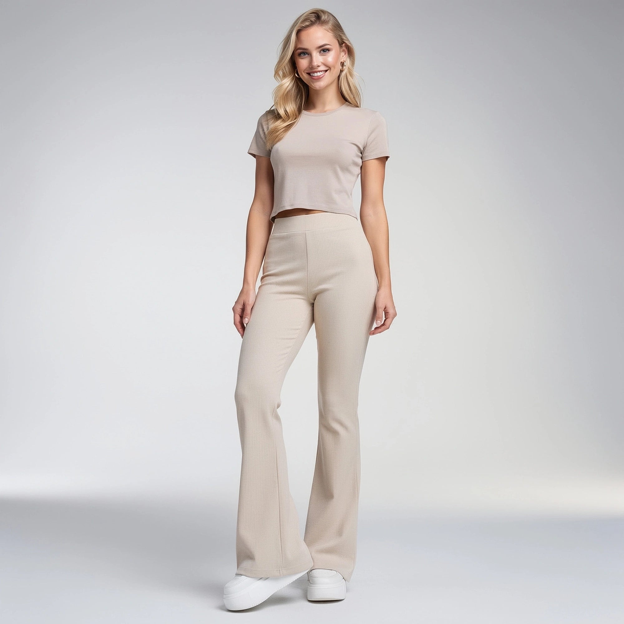 View of stylish flared trousers in soft fabric, featuring a comfortable fit and a chic silhouette