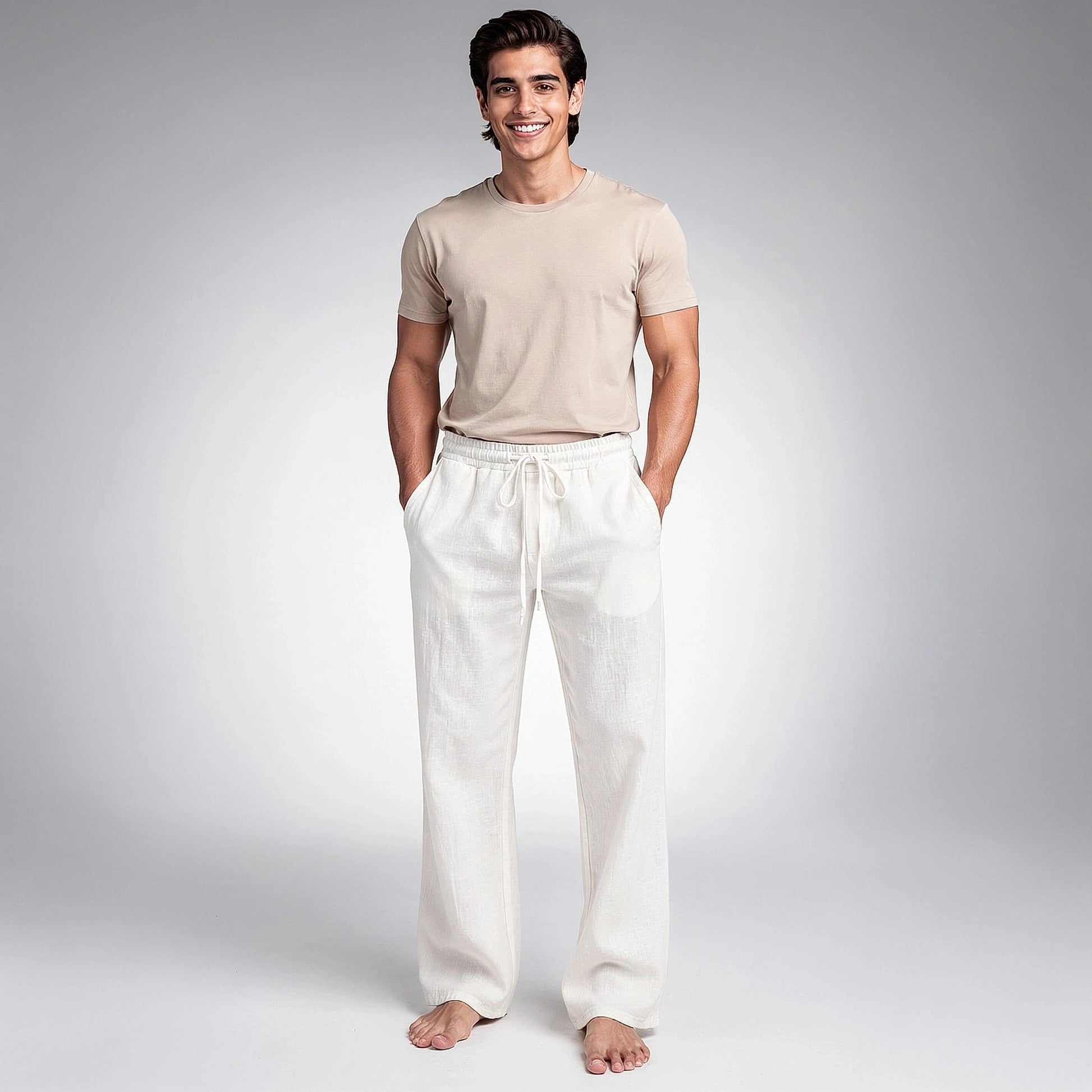 View of relaxed wide leg trousers in light beige fabric, featuring a comfortable waistband and pockets