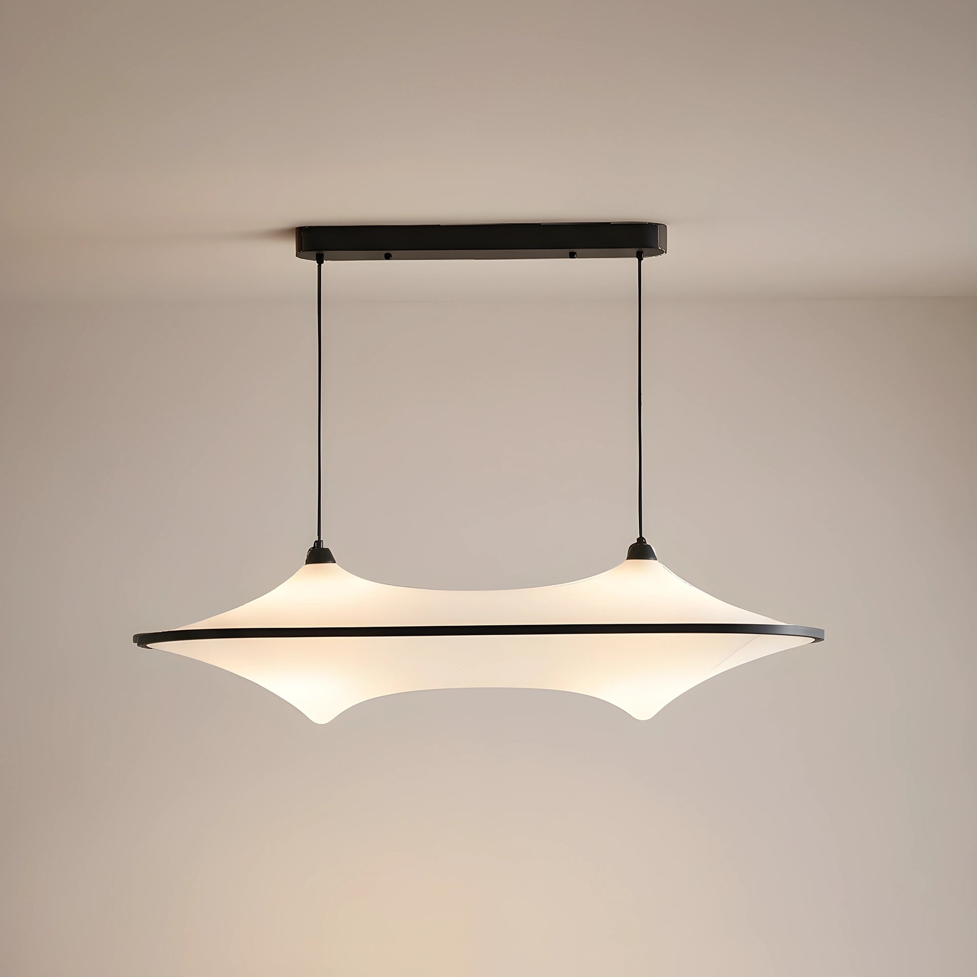 A sleek modern iron pendant light fixture is showcased in a full front view, showing its minimalist design against a white background.