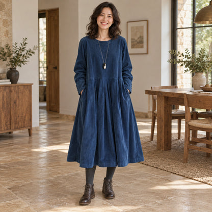 fall dress — Harper Blue complete front view, worn by a joyful smiling adult model age 30 in real setting