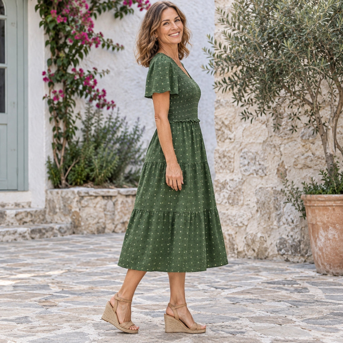 fall dress — Luna Smocked Flutter Sleeve Tiered Midi Dress Army Green side worn by an adult model in a realistic — view 5