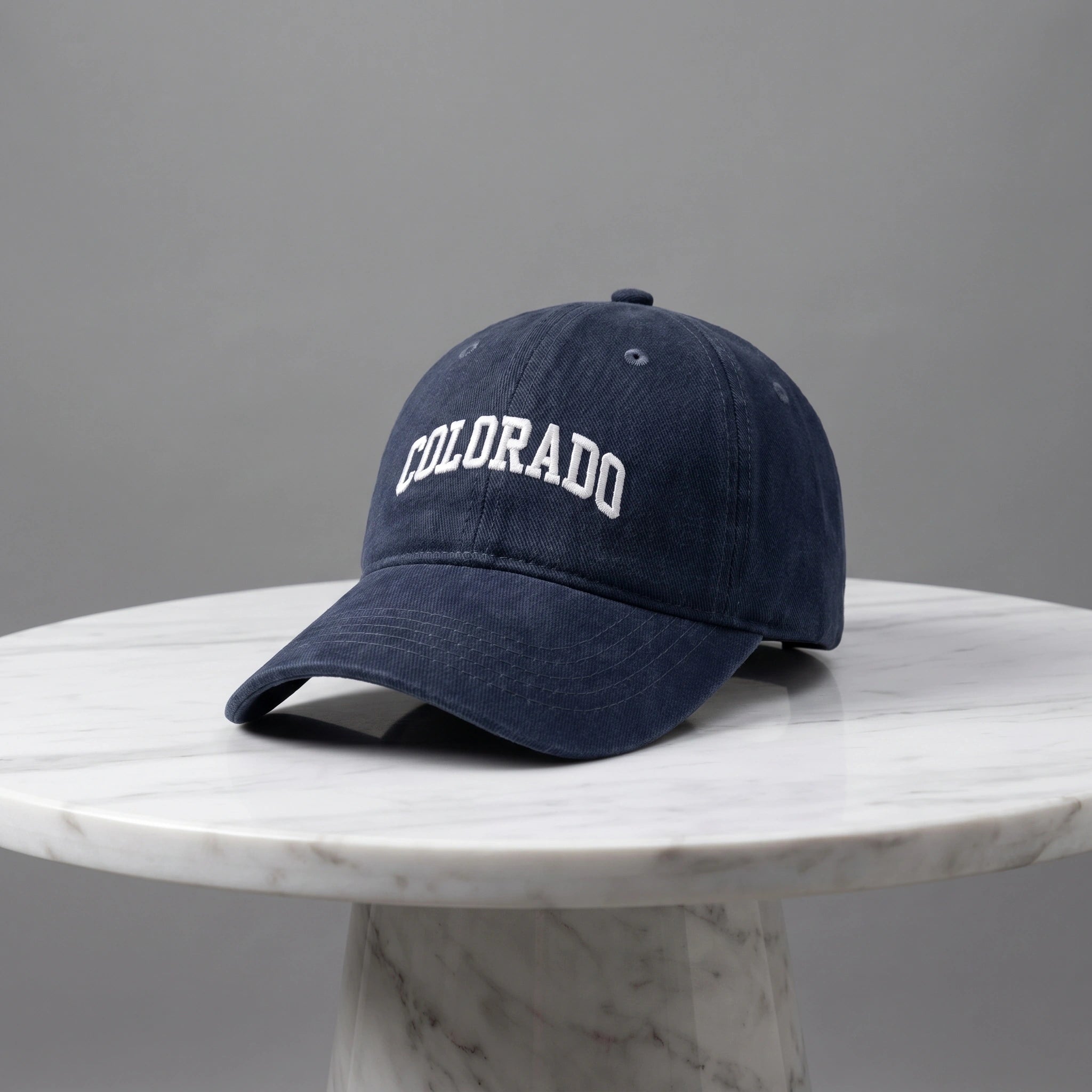 Close up view of the CanyonPeak baseball cap showing its durable fabric, precise stitching, and adjustable strap, perfect for outdoor adventures.