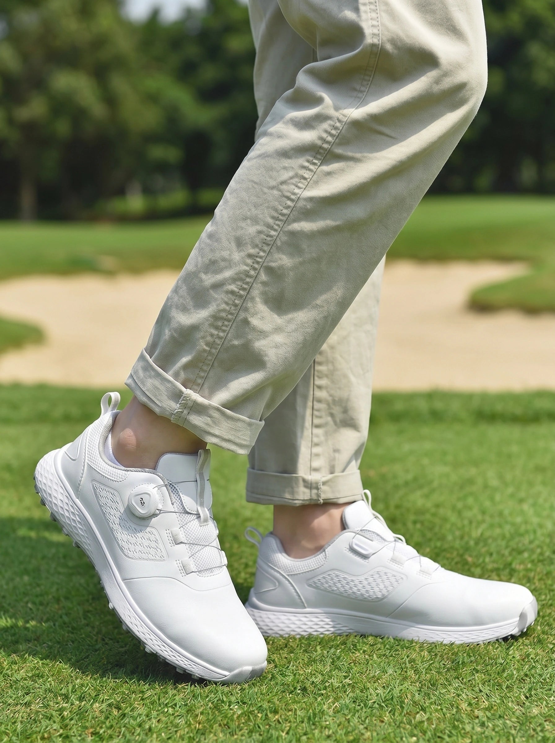 Close up view of the men's waterproof casual golf sneakers showing the high quality fabric, intricate stitching, and modern design elements against a neutral background.