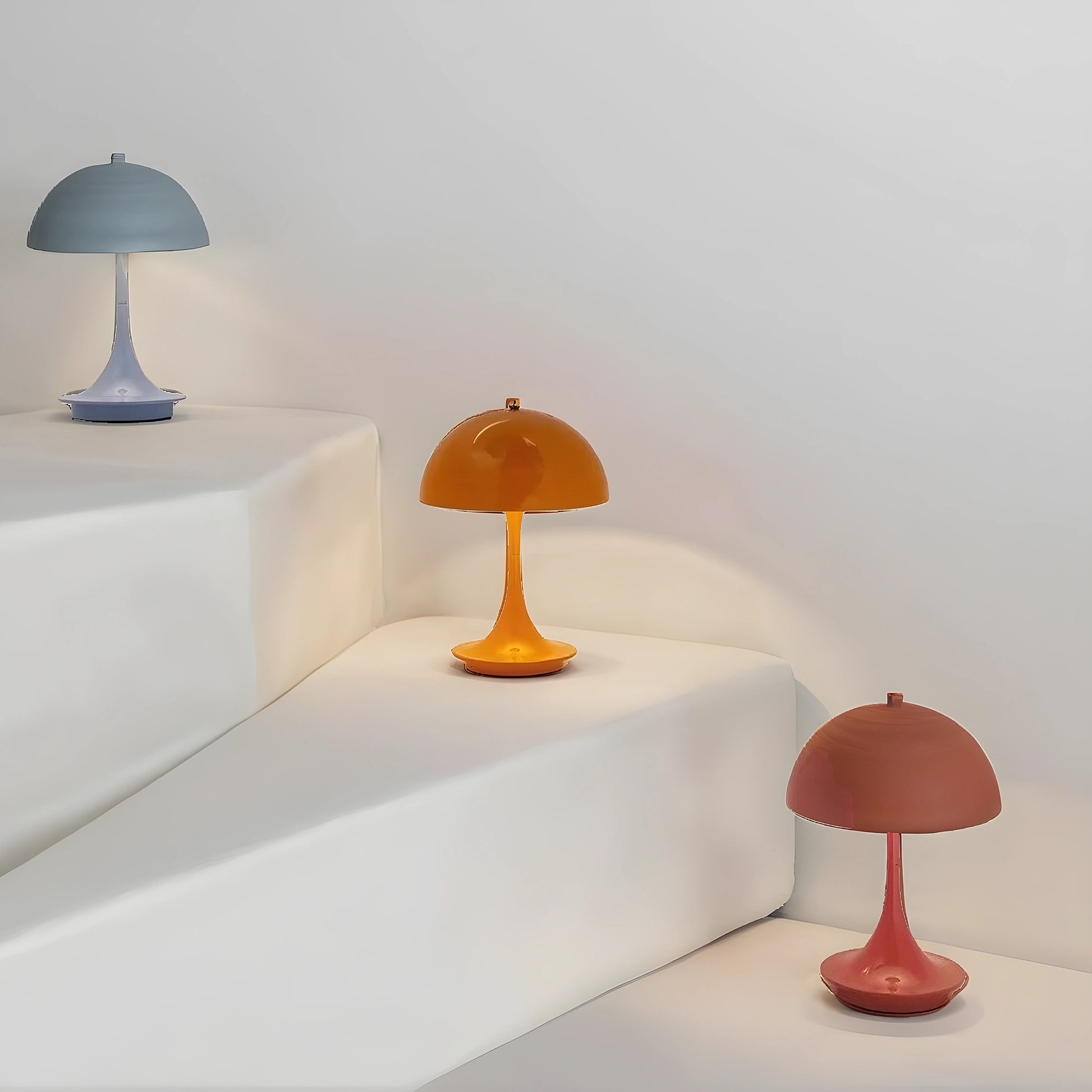 View of a sleek contemporary rechargeable table lamp with a metallic base and a soft white shade, showcasing its elegant design