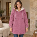 fleece jacket — Audrey Pink complete front view, worn by a joyful smiling adult model age 29 in real setting