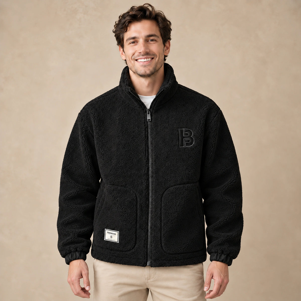 Milan Black textured fleece jacket front image on a happy male model, complete garment.