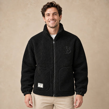 Milan Black textured fleece jacket front image on a happy male model, complete garment.