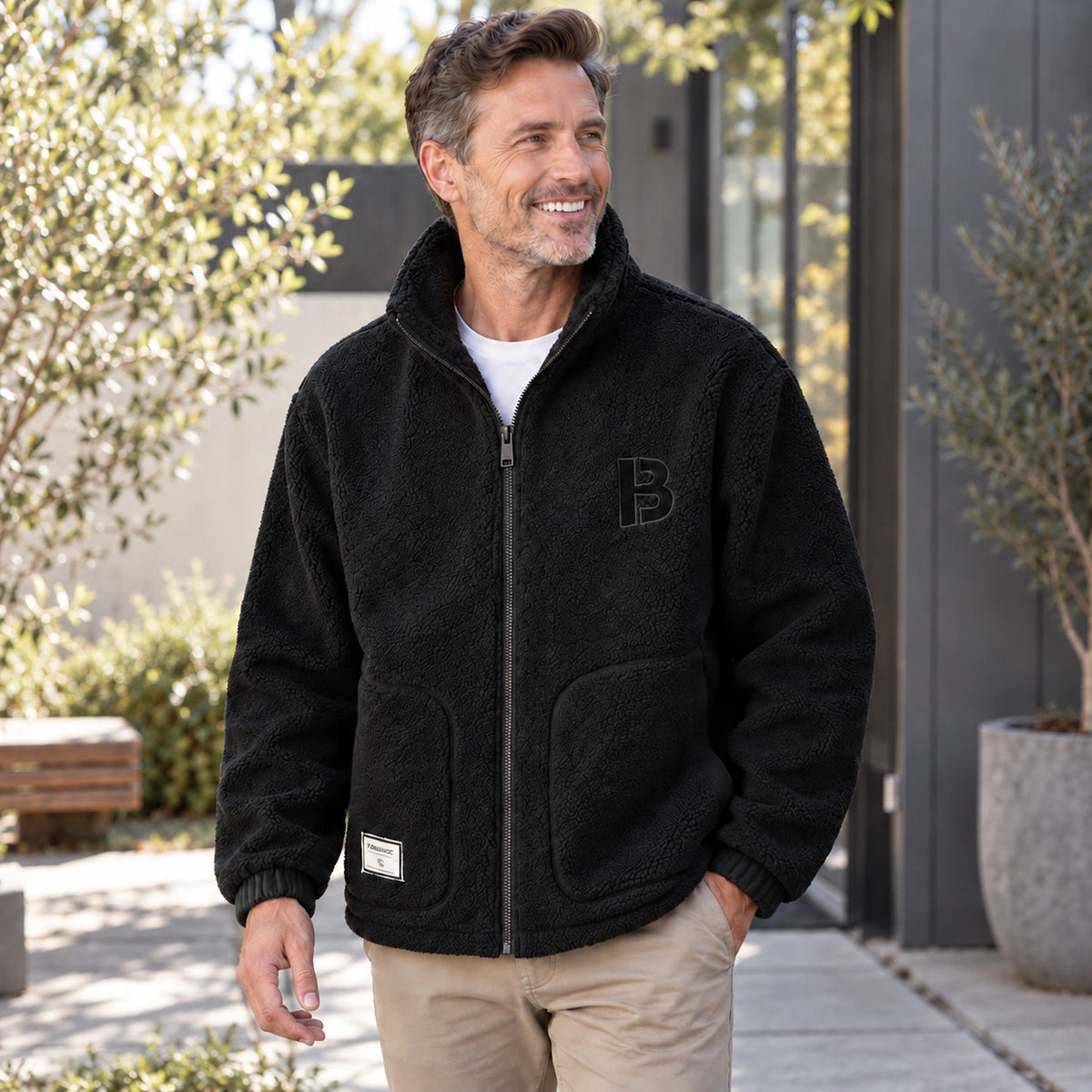 Milan Black textured fleece jacket three quarter view on a mature male model. — view 4
