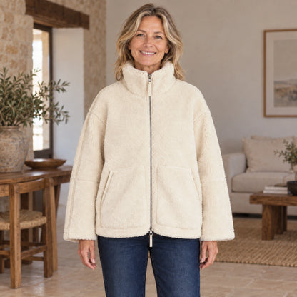 fleece jacket — Nora White complete front view, worn by a joyful smiling adult model age 51 in real setting — view 2