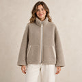 Khaki Avalon fleece jacket, complete front view on young model in warm neutral