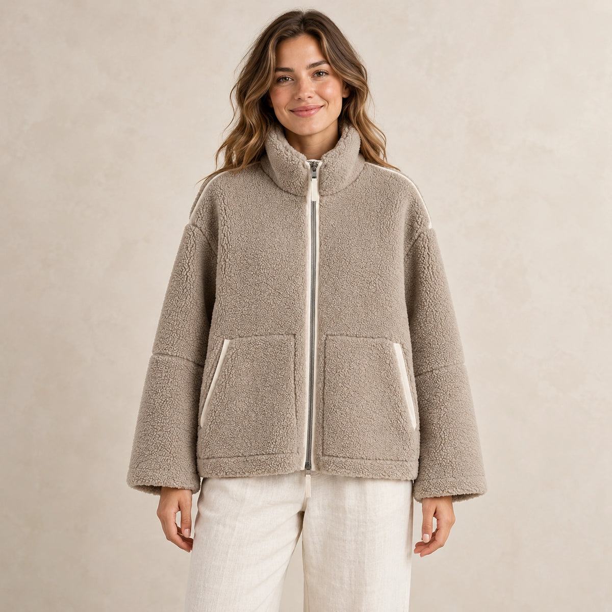 Khaki Avalon fleece jacket, complete front view on young model in warm neutral