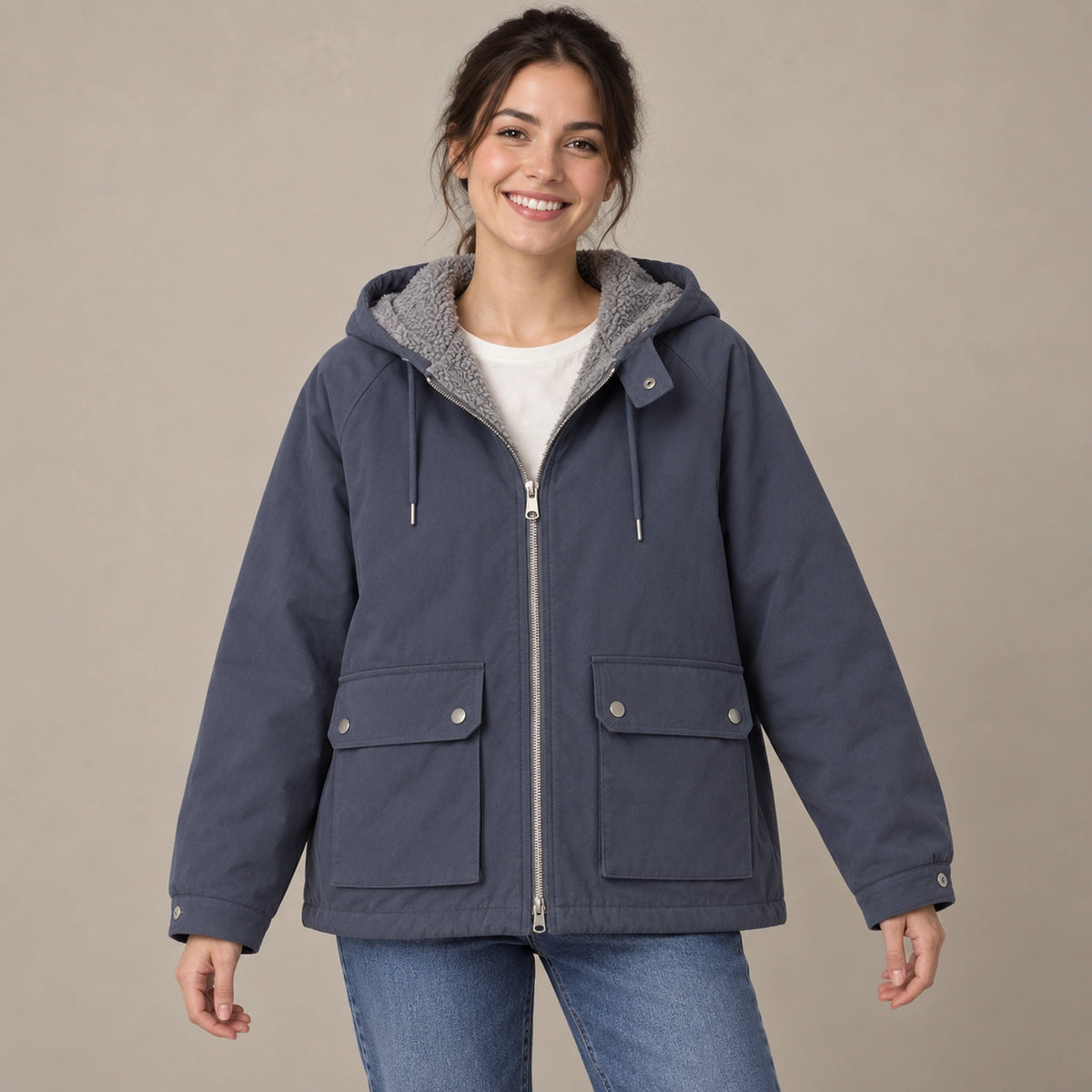fleece jacket — Blue Freya reversible hooded jacket, complete front view with smooth shell outward, young model in warm