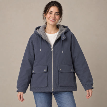 fleece jacket — Blue Freya reversible hooded jacket, complete front view with smooth shell outward, young model in warm