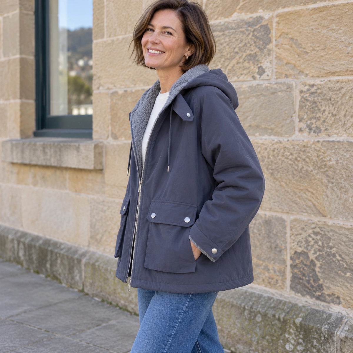 fleece jacket — Blue Freya reversible jacket, side view showing shell pocket and boxy fit on mature model — view 6