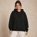 Black butterfly and rose print hoodie, complete front view worn by a happy model