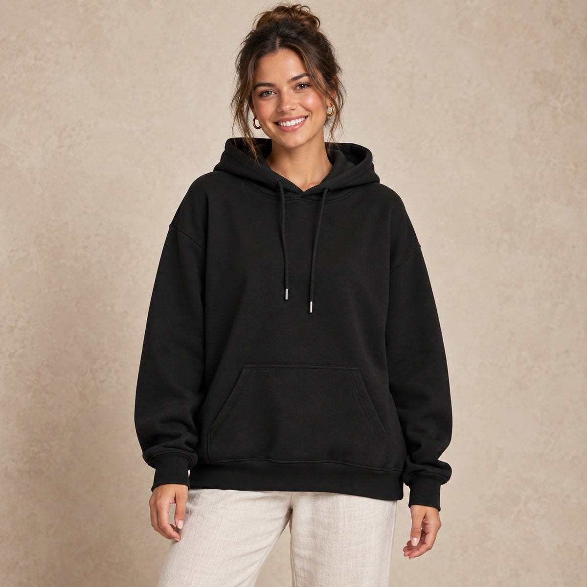Black butterfly and rose print hoodie, complete front view worn by a happy model