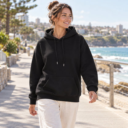 Black butterfly and rose print hoodie, complete front view on a cool coastal morning — view 7
