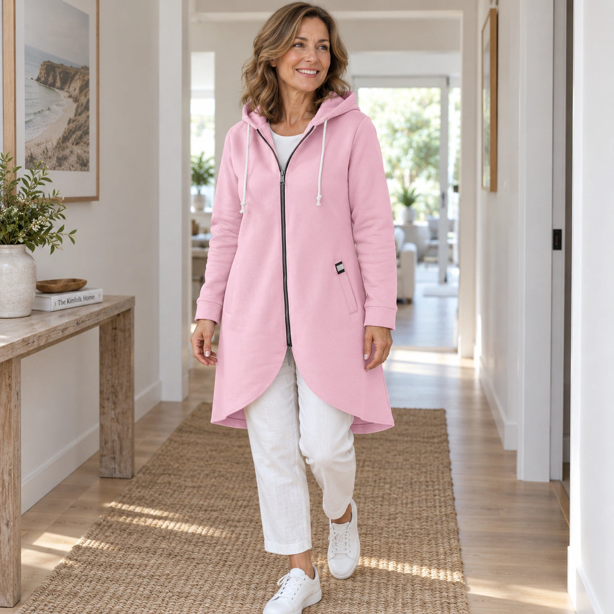Shaly Pink longline zip up hoodie three quarter view in natural Australian light. — view 5