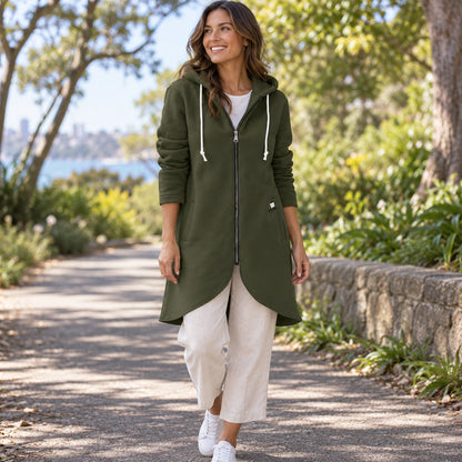 Shaly Dark Green longline zip up hoodie three quarter view, complete curved hem visible. — view 6