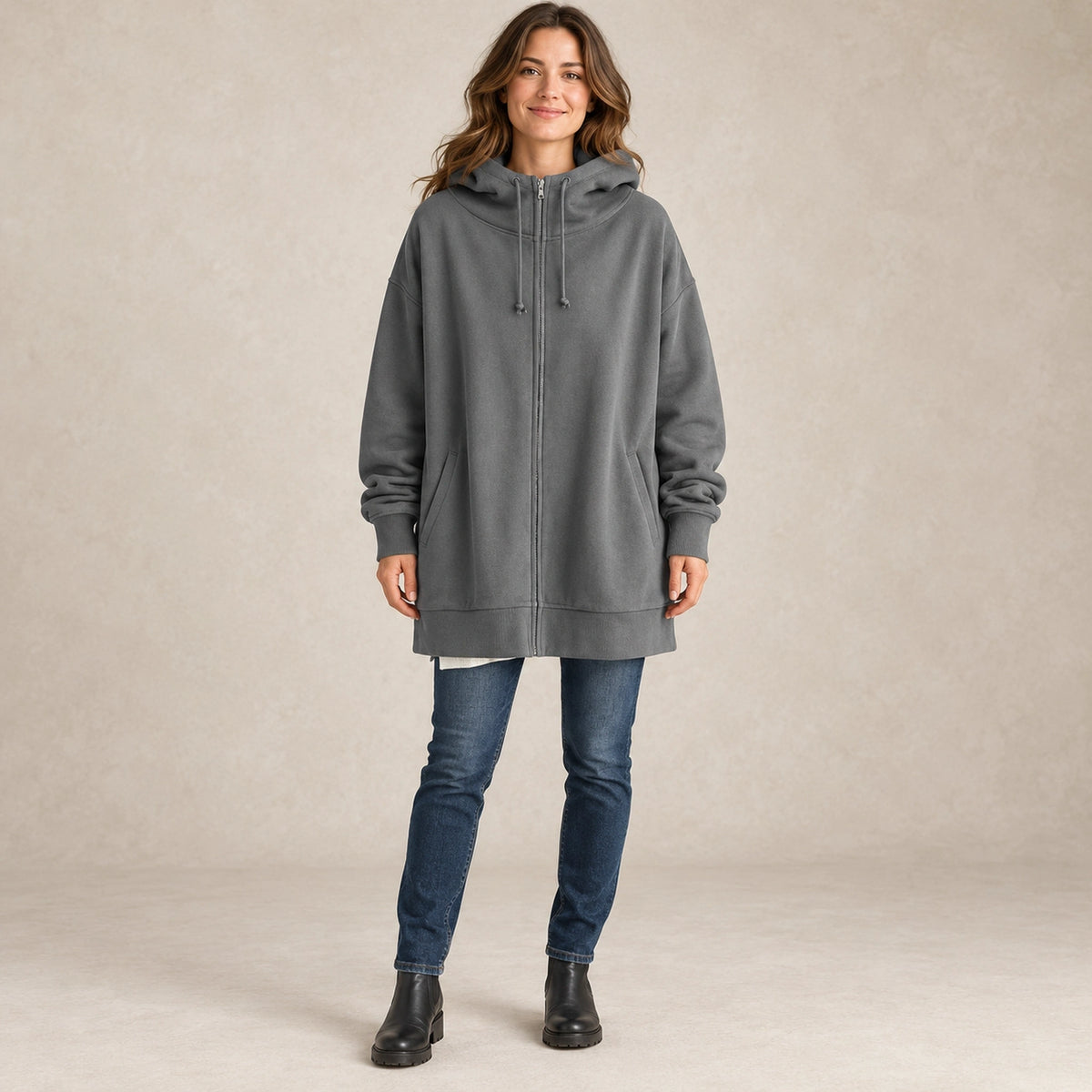 Women's Oversized Longline Zip Up Hoodie — Meliora, Gray, complete front view, worn by an adult model, professional image