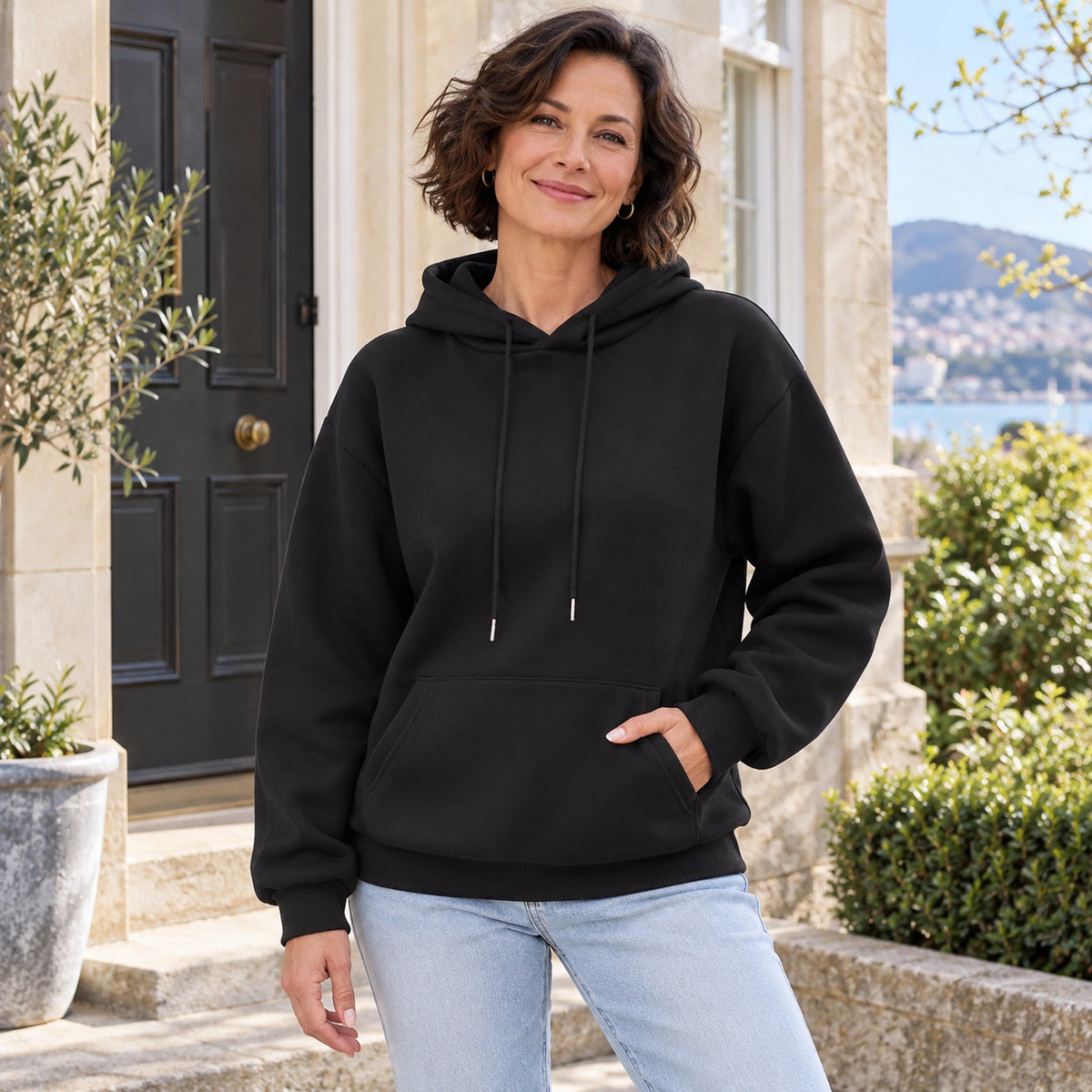 Black Lilac pullover hoodie, three quarter view on mature model — view 4