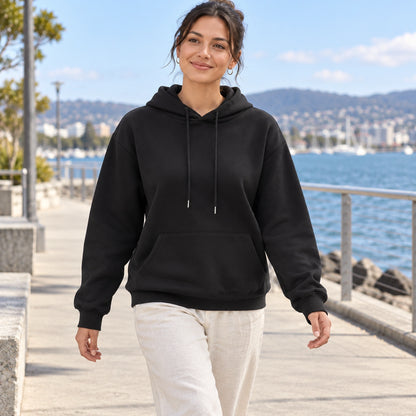 Black Lilac pullover hoodie, young model on a mild Tasmanian waterfront walk — view 8