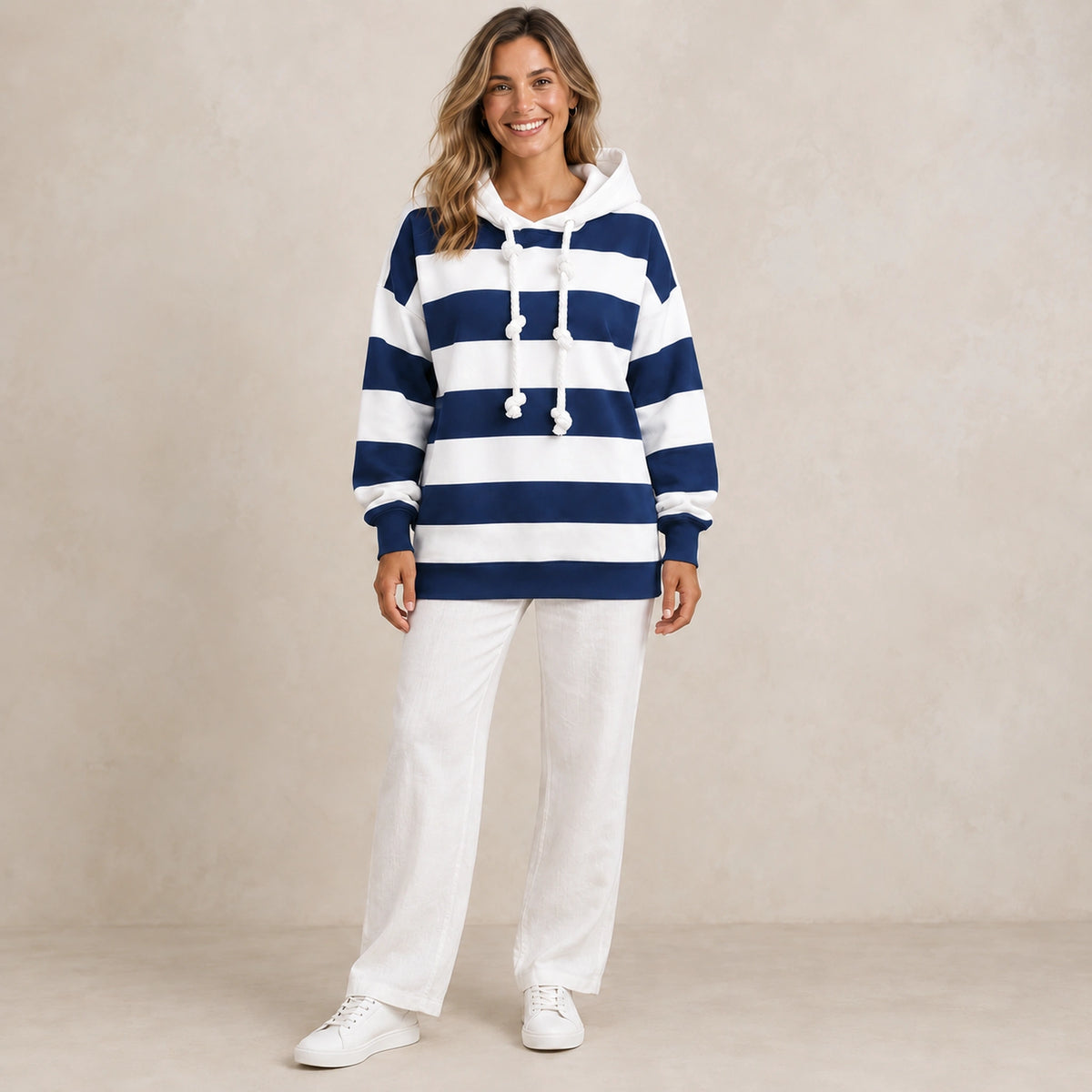 Elise Blue striped hoodie front image, complete garment on a happy female model.