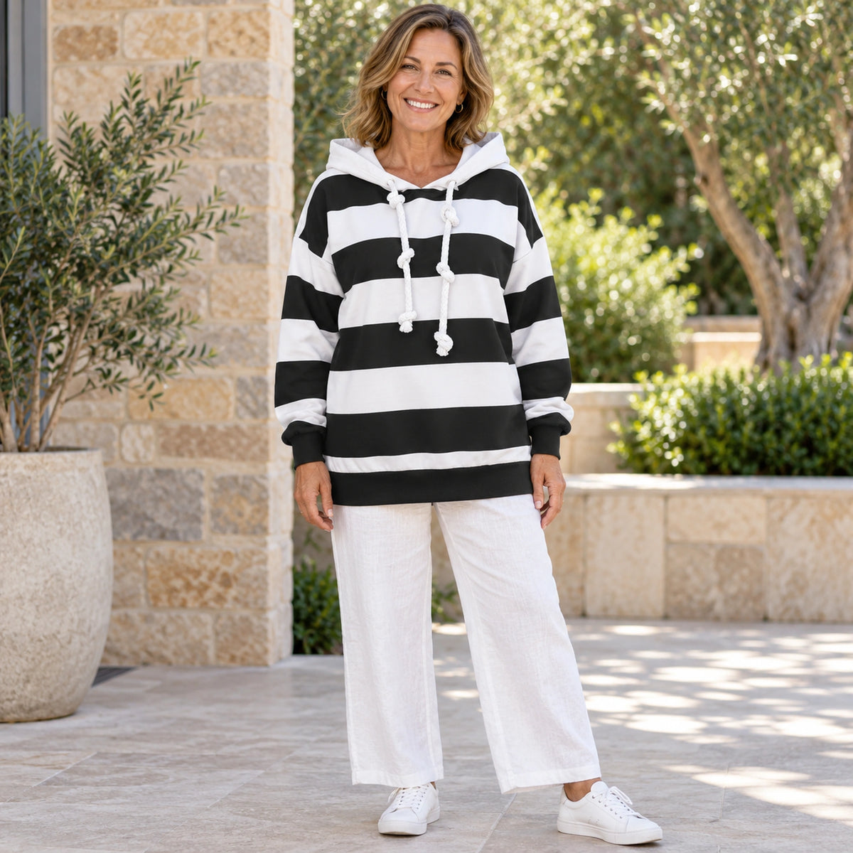 Elise Black striped hoodie front color image, complete garment on a happy mature female model. — view 4