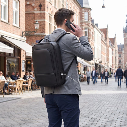The back view of durable laptop backpack highlights its sleek Pu leather construction, adjustable straps, and — view 2