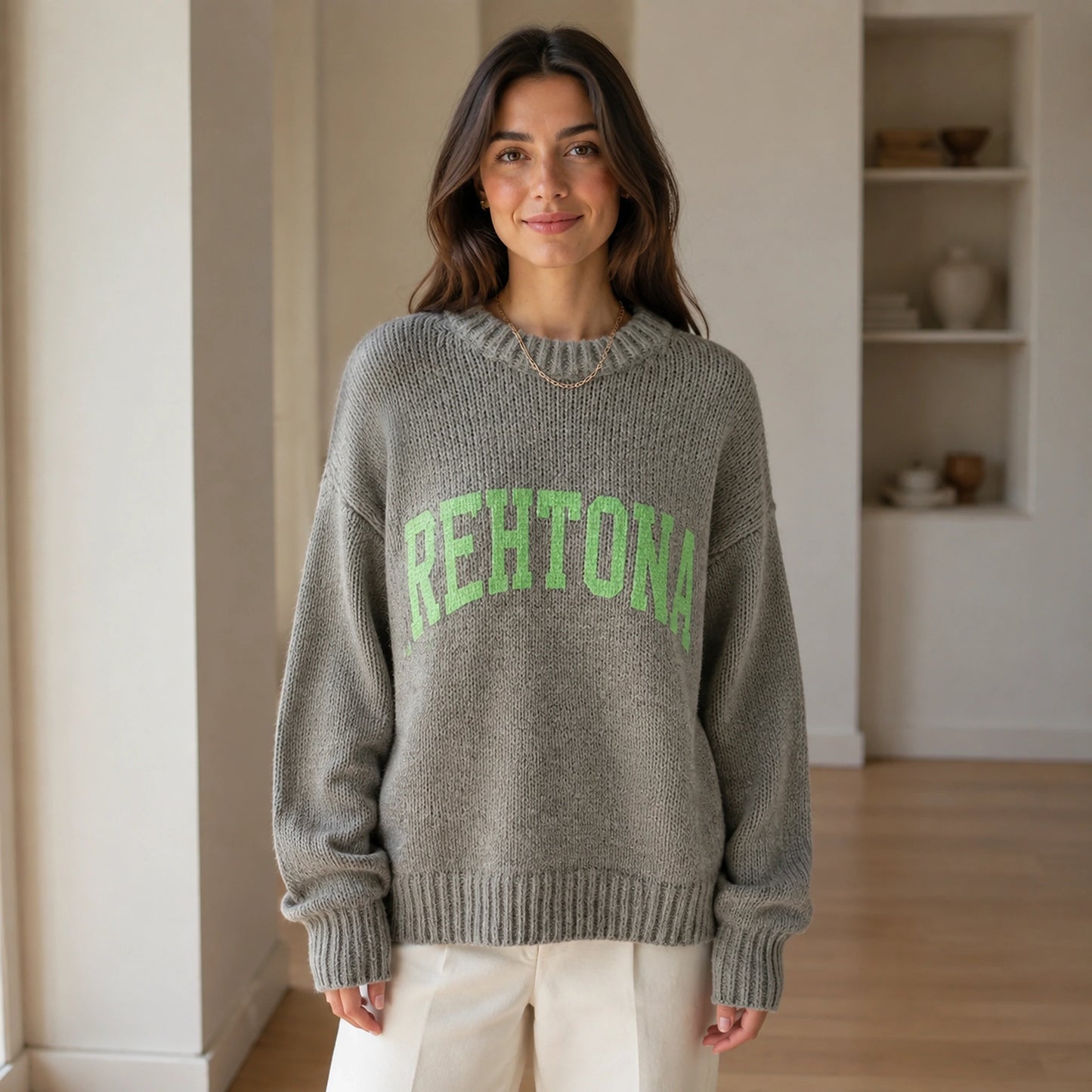 Woman wearing gray collegiate letter letterman sweater, complete front view — view 5