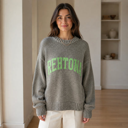 Woman wearing gray collegiate letter letterman sweater, complete front view — view 5