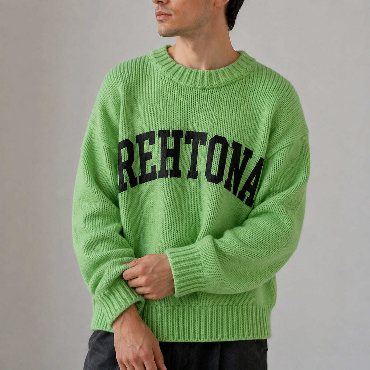 Close up of green collegiate letter letterman sweater knit and ribbed cuffs — view 7