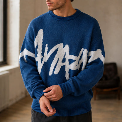 Close up of blue graffiti jacquard letterman sweater knit and ribbed cuffs — view 7