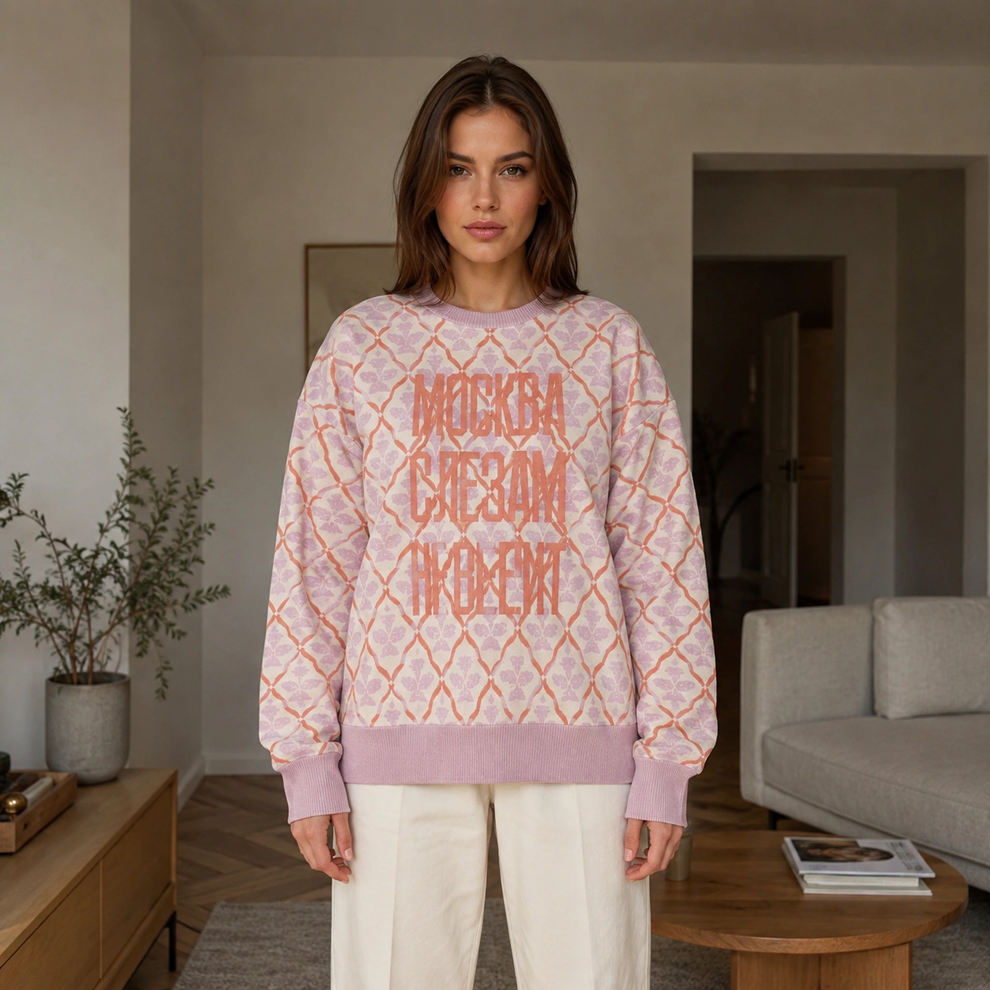 Woman wearing pink lattice jacquard letterman sweater, complete front view — view 3