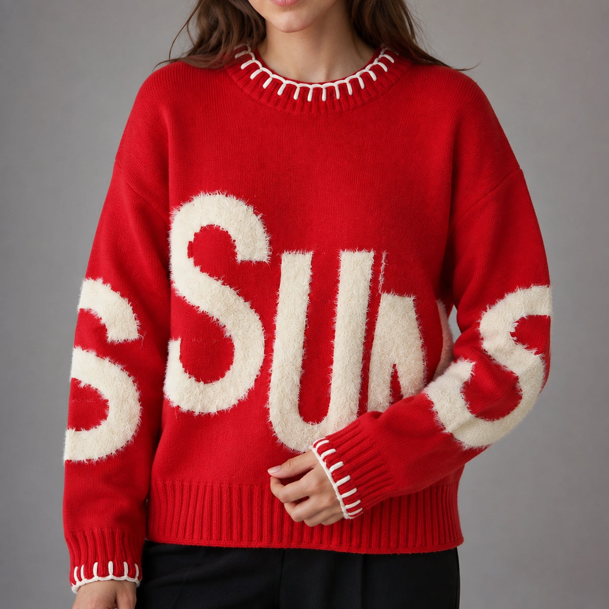 Close up of red fuzzy letter pattern letterman sweater and contrast stitching — view 6