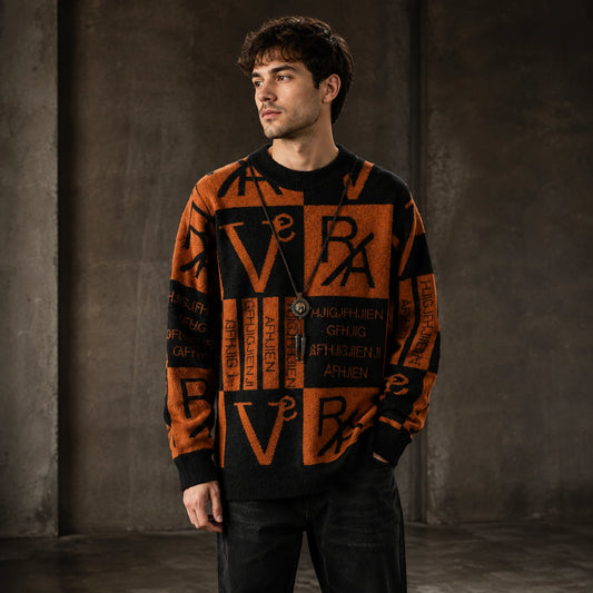 Male model wearing men's rust brown and black abstract jacquard letterman sweater, complete front view — view 2