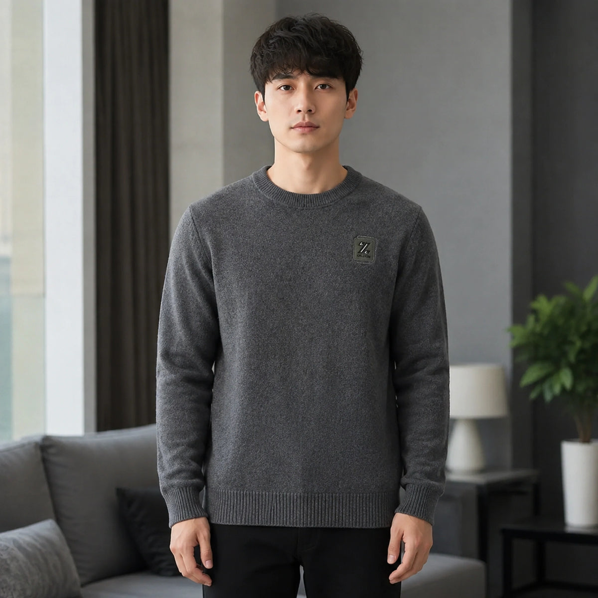 Male model wearing men's gray fleece lined patch letterman sweater, complete front view — view 2