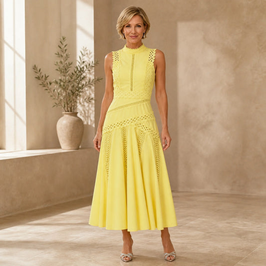 long wedding guest dress — Yellow cutwork sleeveless midi wedding guest dress on a mature woman