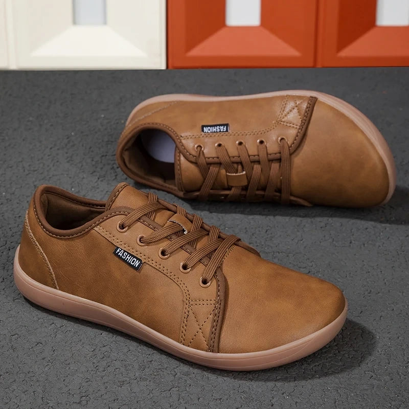 Brown microfiber marching band shoes with laces, displayed on a textured surface — view 2