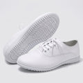 Close up view showing the soft split leather fabric and precise stitching details of comfortable marching band shoes in a
