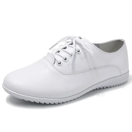 White marching band shoes with lace up design and textured sole, side view — view 2