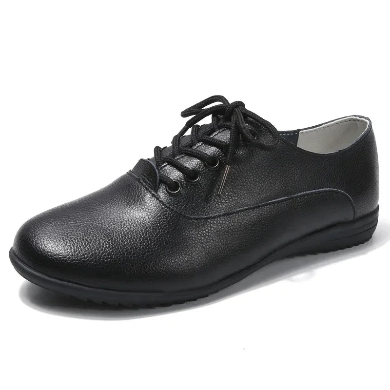Black marching band shoes with lace up design and textured surface — view 7 — view 6
