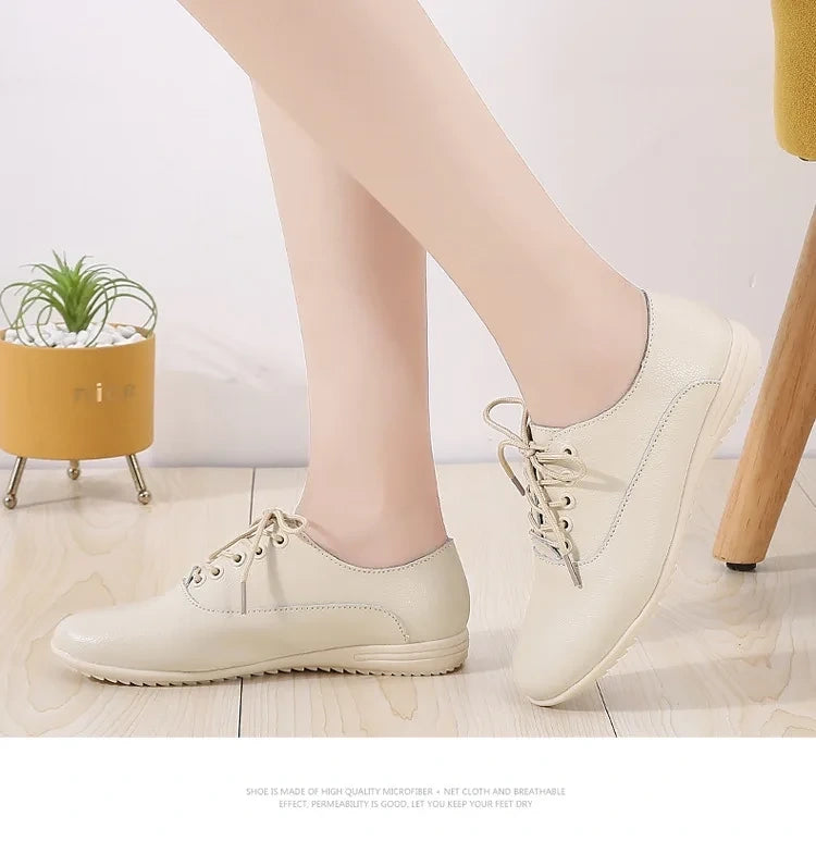 Comfortable beige marching band shoes with lace up design on a wooden floor — view 14 — view 7