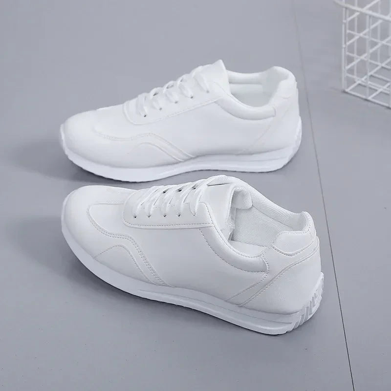 White marching band shoes with lace up design and cushioned sole, side view — 6 — view 5