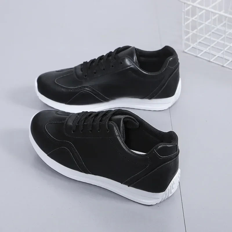Black marching band shoes with lace up design and white soles, angled view — 7 — view 6