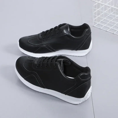 Black marching band shoes with lace up design and white soles, angled view — 7 — view 6