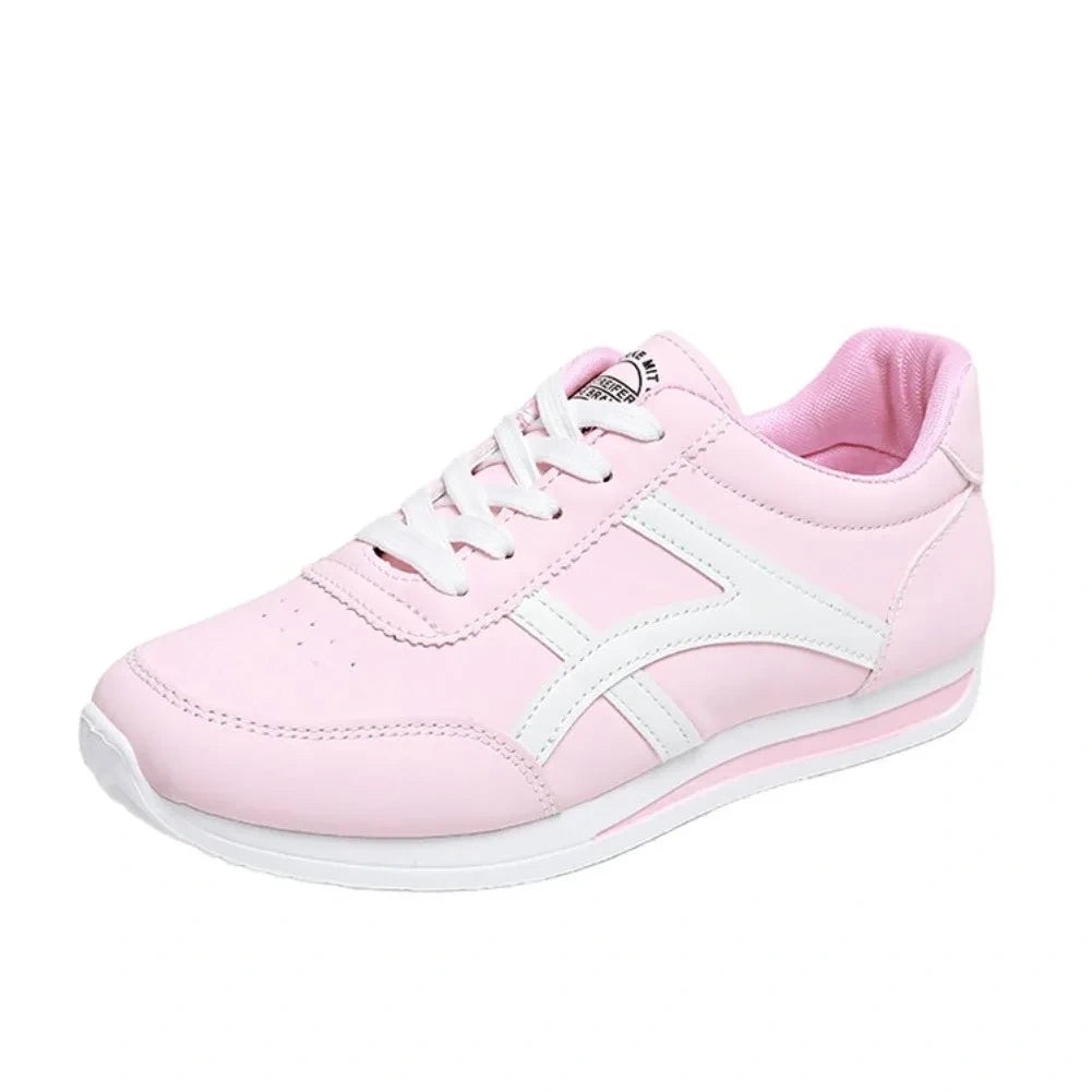 Pink low top marching band shoes with white accents and laces, side view — 3 — view 4