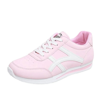 Pink low top marching band shoes with white accents and laces, side view — 3 — view 4